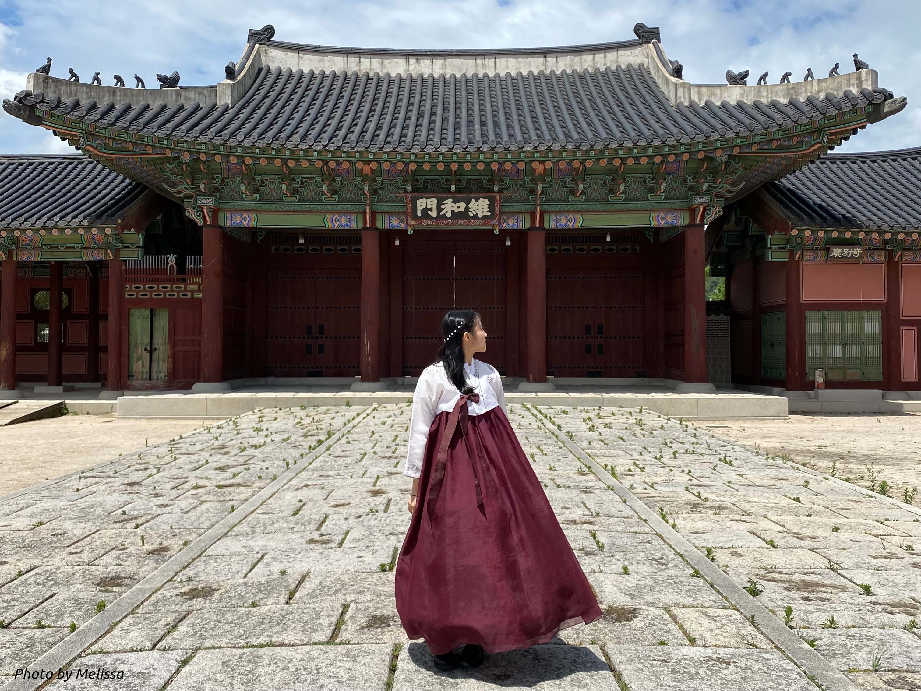 Inside Gyeongbokgung Palace wearing a traditional hanbok