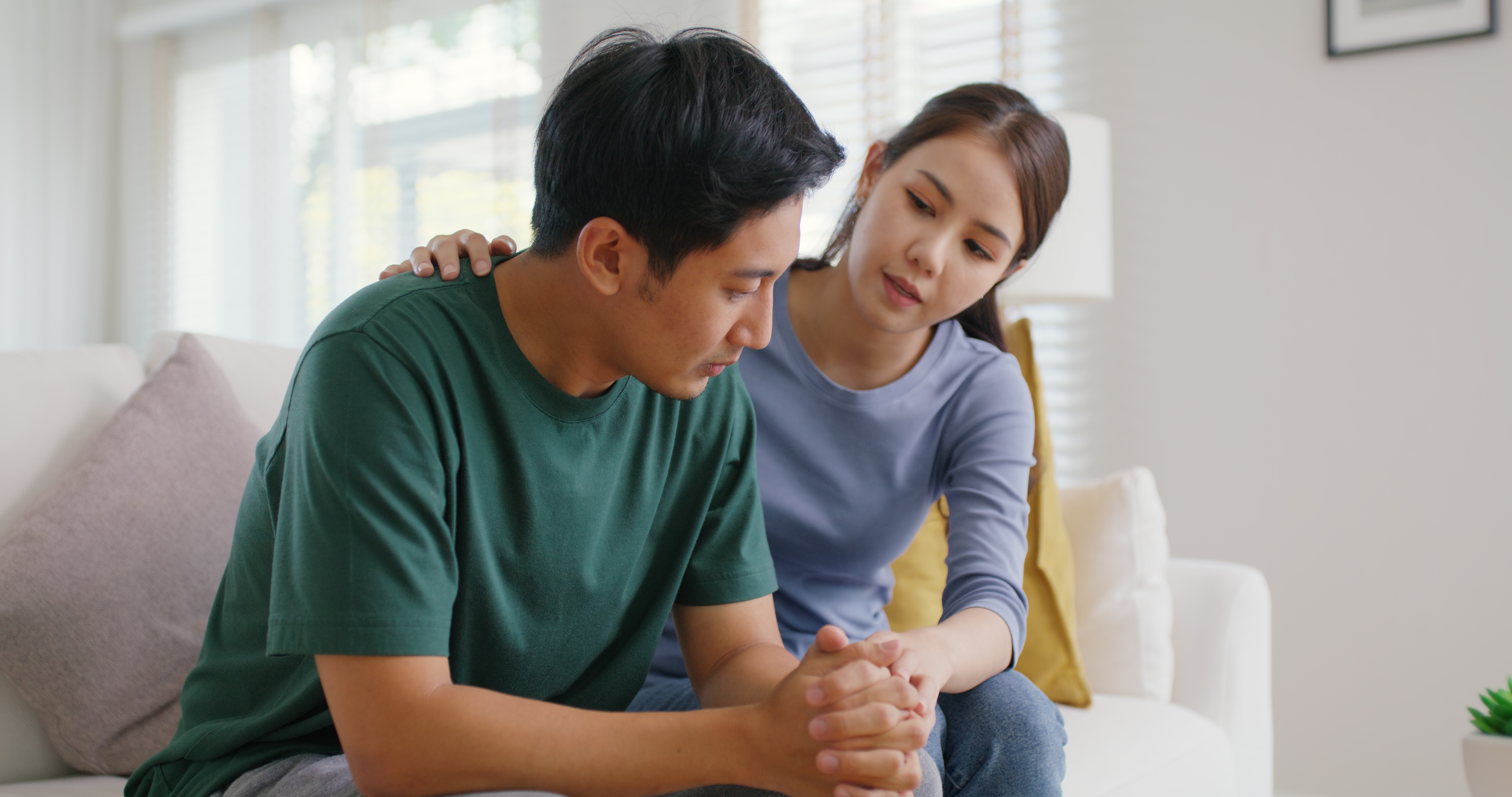 Anxious husband with caring wife