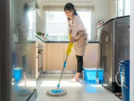 Maid mopping the kitchen floor